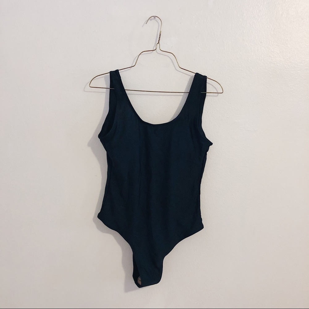 Brand new black one piece swimsuit with low back